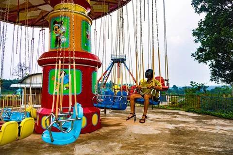 Guy with a motorcycle helmet (daftpunk like) on flying chairs in an abandon.. Stock Photos