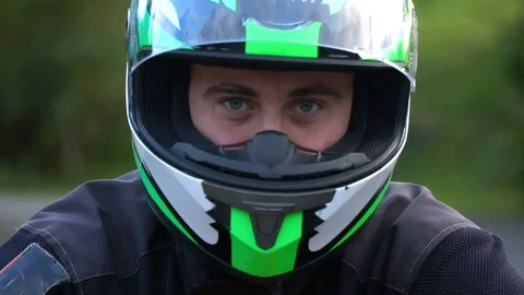 A guy on a motorcycle. Young handsome guy with his motorcycle in the mountains 스톡 동영상 96154033