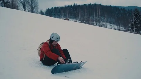 Guy in the mountains snowboarding clothes Stock Footage 72349870