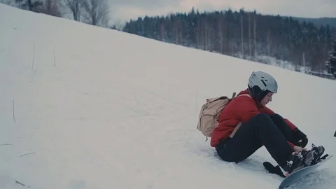 Guy in the mountains snowboarding clothes Stock-Footage 72349900