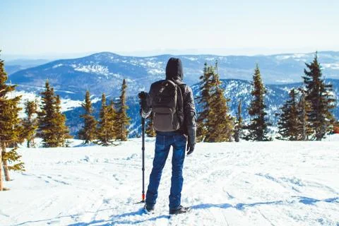 The guy is in the mountains in the winter Stock Photos