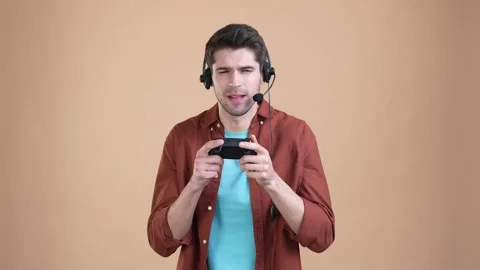 Guy multiplayer play race speed fist up isolated pastel color background Stock Footage 169939262