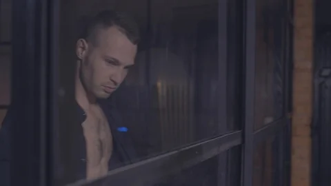 The guy near the window Stock Footage 105566104