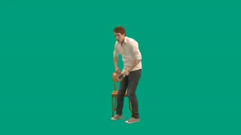 Guy with newspaper sits down on chair - green screen - pre keyed - MINT.GS Stock Footage 11356637