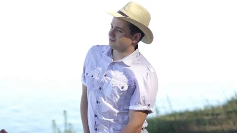 A Guy in a Nice Shirt and Hat Stock Footage 70812631