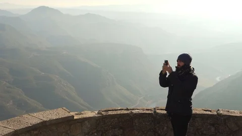 The guy on the observation deck looks at a beautiful view of the mountains Stock Footage 101270014