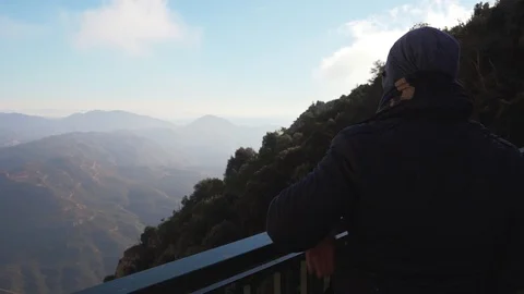 The guy on the observation deck looks at a beautiful view of the mountains Stock Footage 101270025