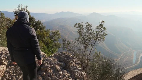 The guy on the observation deck looks at a beautiful view of the mountains Stock Footage 101270037