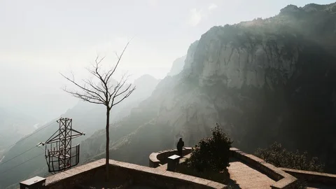 The guy on the observation deck looks at a beautiful view of the mountains Stock Footage 101270048