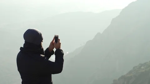 The guy on the observation deck looks at a beautiful view of the mountains Stock Footage 101270187