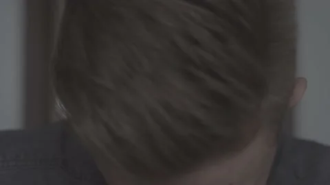 The guy in the office. The guy is looking at the camera. Stock Footage 130220345