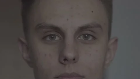 The guy in the office. The guy is looking at the camera. Stock Footage 130220409