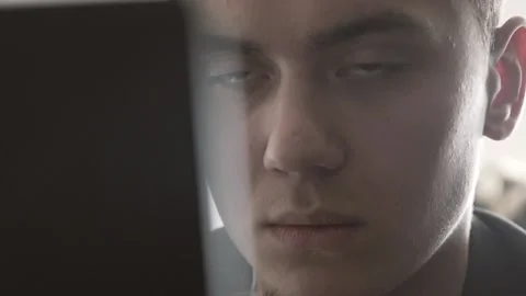 The guy in the office. The guy is working. The guy behind the phone and laptop Stock Footage 130730257