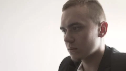 The guy in the office. The guy is working. The guy behind the phone and laptop Stock Footage 130730403