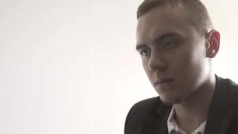 The guy in the office. The guy is working. The guy behind the phone and laptop Stock Footage 130730429