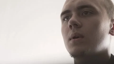 The guy in the office. The guy is working. The guy behind the phone and laptop Stock Footage 130730566