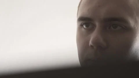 The guy in the office. The guy is working. The guy behind the phone and laptop Stock Footage 130730600