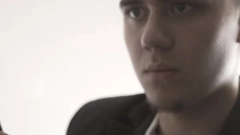 The guy in the office. The guy is working. The guy behind the phone and laptop Stock Footage 130730698