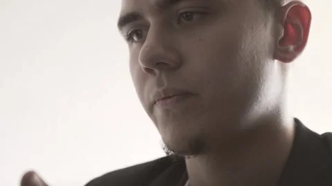 The guy in the office. The guy is working. The guy behind the phone and laptop Stock Footage 130730719