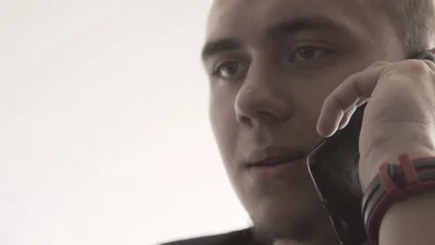 The guy in the office. The guy is working. The guy behind the phone and laptop Stock Footage 130730763