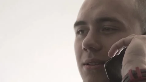 The guy in the office. The guy is working. The guy behind the phone and laptop Stock Footage 130730793