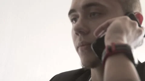 The guy in the office. The guy is working. The guy behind the phone and laptop Stock Footage 130730902