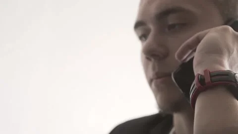 The guy in the office. The guy is working. The guy behind the phone and laptop Stock Footage 130730953