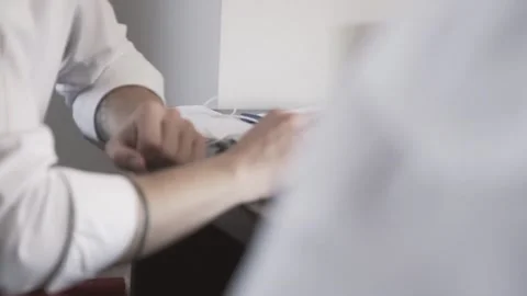 The guy in the office. The guy is working. The guy behind the phone and laptop Stock Footage 130731137