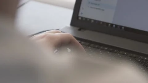 The guy in the office. The guy is working. The guy behind the phone and laptop Stock Footage 130731160