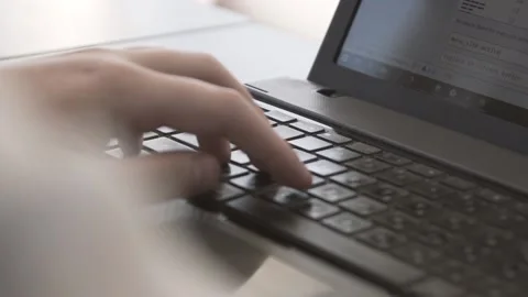 The guy in the office. The guy is working. The guy behind the phone and laptop Stock Footage 130731215