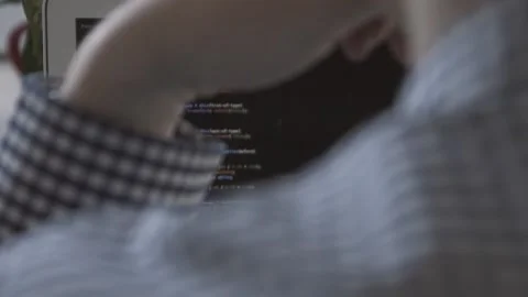 The guy in the office. The guy is working. The guy behind the phone and laptop Stock Footage 130731551