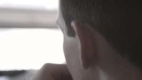 The guy in the office. The guy is working. The guy behind the phone and laptop Stock Footage 130731775