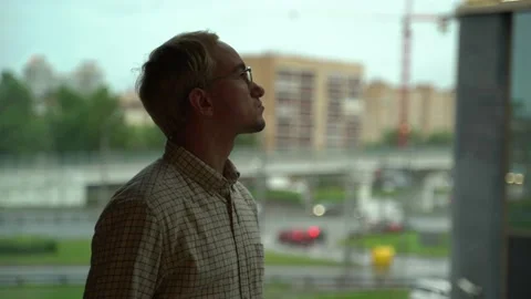 Guy at the office window Stock Footage 131511332