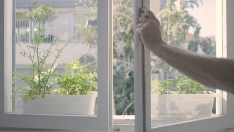 Guy opening a window. Stock Footage 128438106