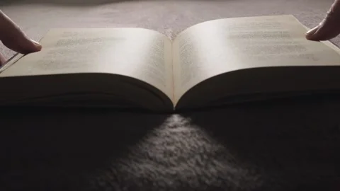 The guy opens the book, the girl opens the book Stock Footage 264130271