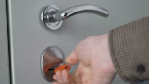 The Guy Opens the Door to the House with a Key And Pulls the Door Handle. The Gu Stock Footage 152144283