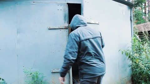 The guy opens the garage door Stock Footage 113859222