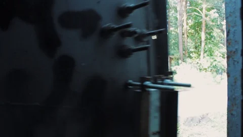 The guy opens the garage door with a key and goes inside Stock Footage 113859239