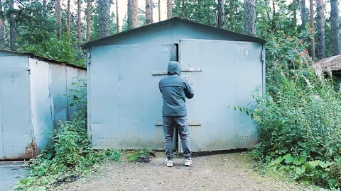 The guy opens the garage doors Stock Footage 113859256