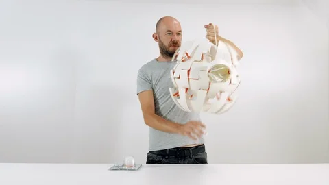 The guy opens the lamp. LED Lamp Stock Footage 102784155