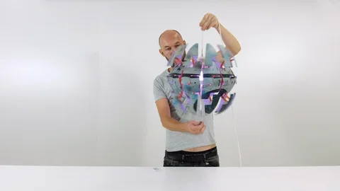 The guy opens the lamp. The young man turns on the lamp Stock Footage 102889258