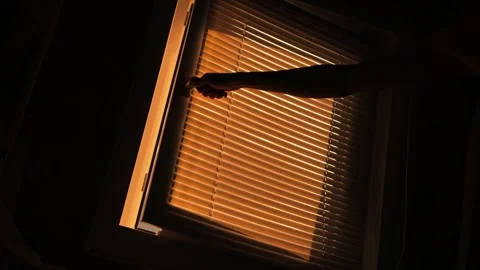 The guy opens the window and opens a view of the golden Stockbeeldmateriaal 162193768