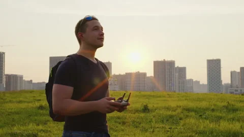 Guy operates with remote control aerial mobile drone Video stock 203000771