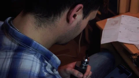 A guy orders a gift in his phone via the Internet, a fan, for a processor Stock Footage 121326487