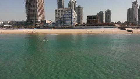 A guy with a paddle standing on a surfboard, top view Stock Footage 147477336
