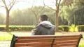 Guy at park with mp3 player HD Footage