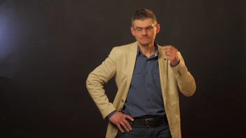 Guy performs confused person emotions posing close Stock Footage 129304874
