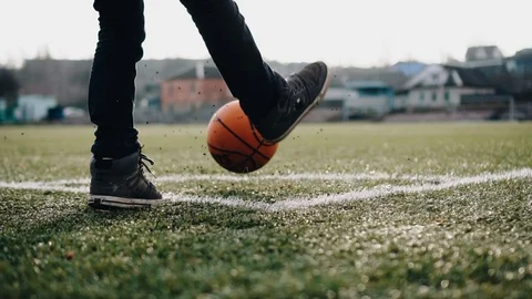 The guy performs a corner kick. close- up of the ball and legs Stock Footage 125856738