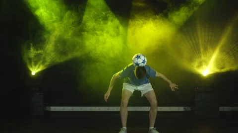 The guy performs football freestyle Stock Footage 67942450