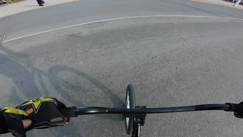 A guy performs a trick on a bicycle, jumps down the stairs Stock Footage 195558466